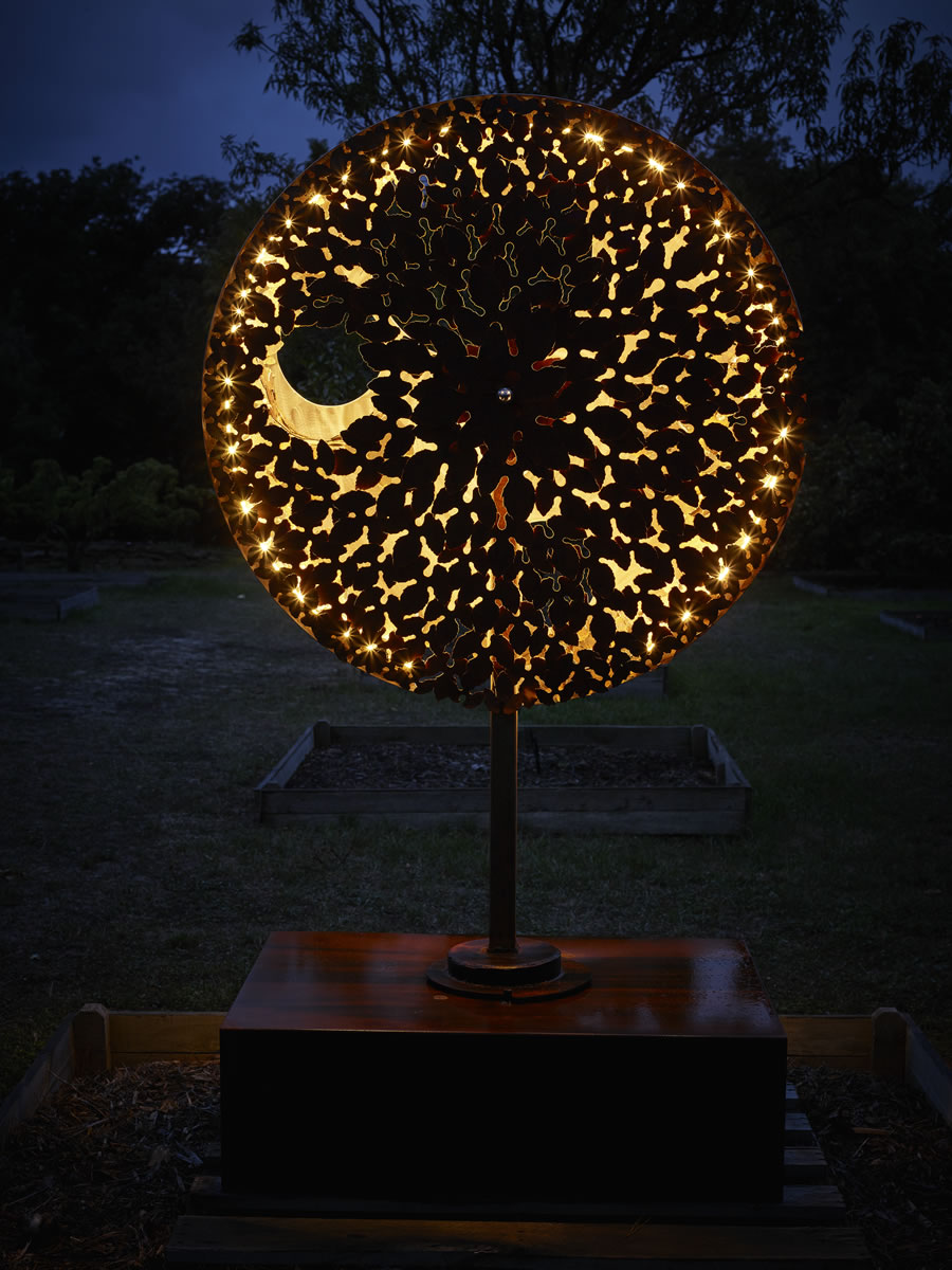 1.2m diameter, 2m tall, two sided corten steel/stainless steel on swivel with exterior LED lighting (side 2)