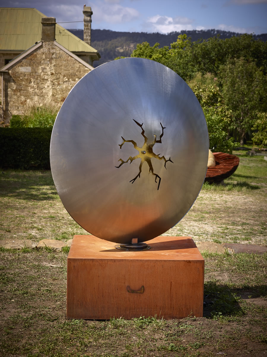 1.5m diameter, two sided stainless steel/corten steel/gold on swivel with exterior LED lighting (side 2)