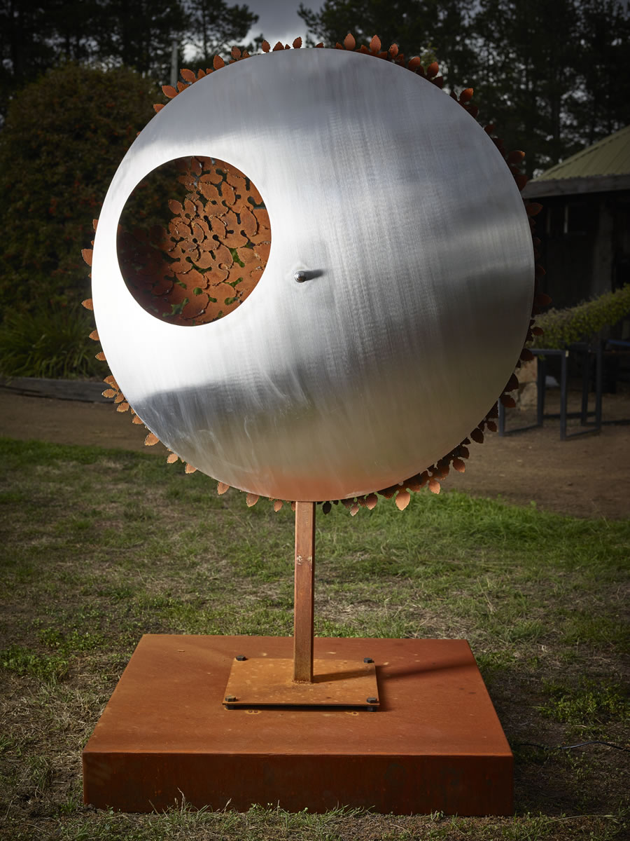 1.2m diameter, 2m tall, two sided corten/stainless steel with exterior LED lighting (side 1)